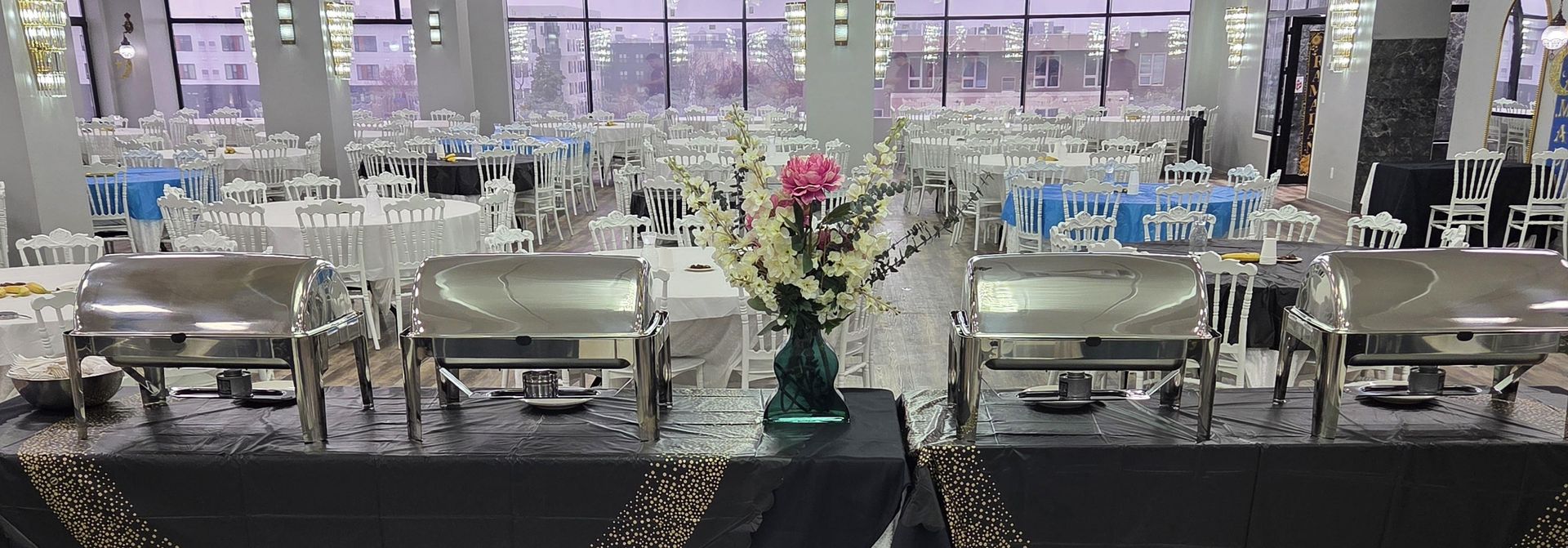Buffet with floral centerpiece and city view