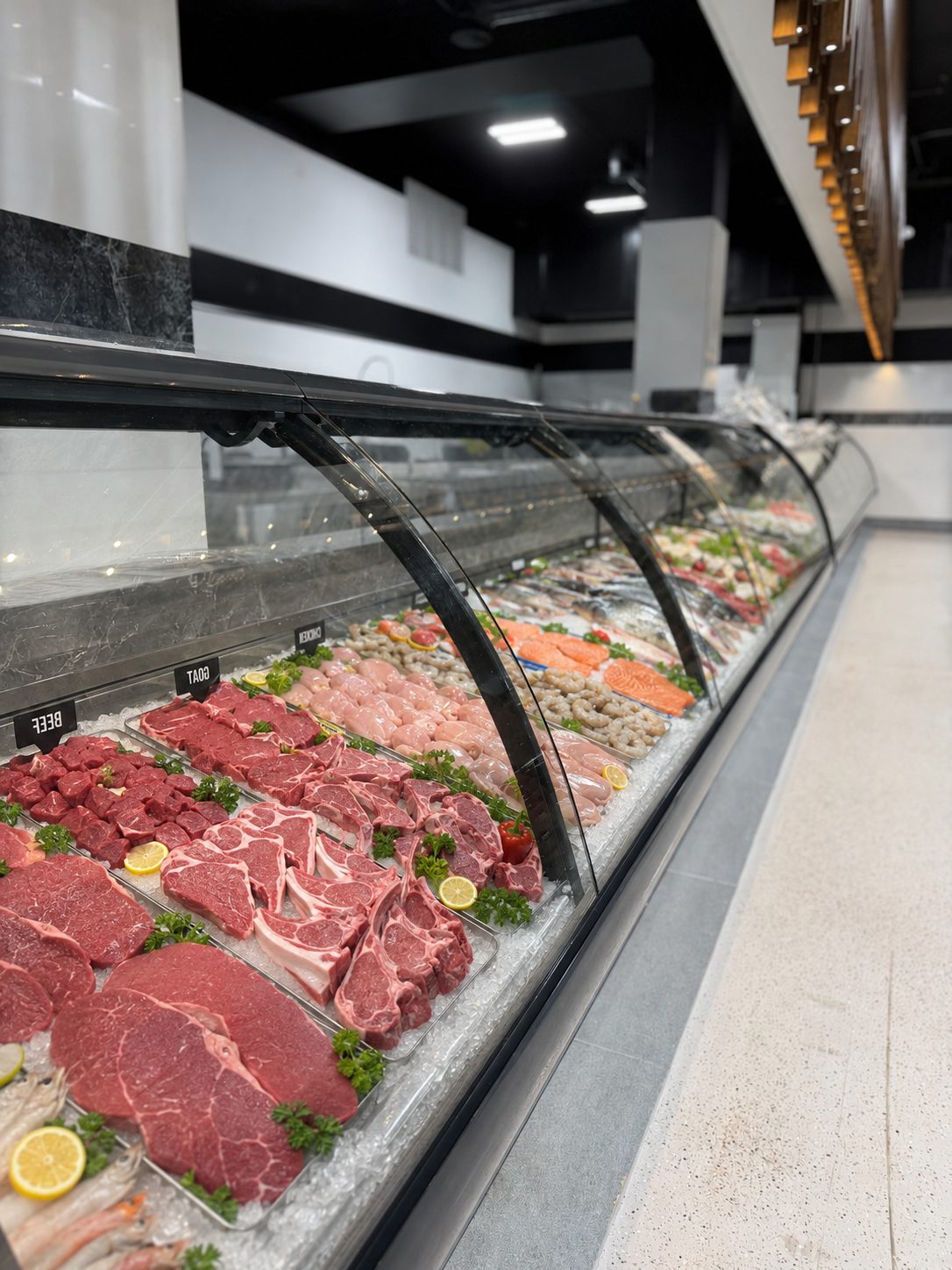 Fresh meat and seafood counter at Karmel Market